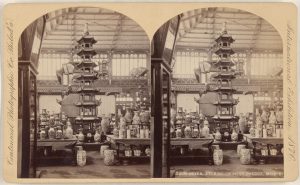 Photo of a Chinese pagoda at the Centennial fair. Vases surround it.