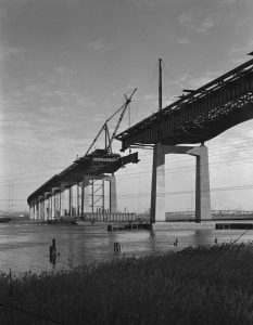 A 1951 photograph depicts the construction of a bridge along the New Jersey Turnpike.