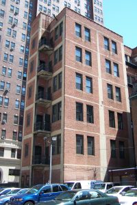 Color photograph showing brick building with a Philadelphia fire tower attached.