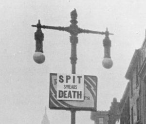 A photograph of a sign outside City Hall posted by the Philadelphia Board of Health to combat the influenza epidemic.