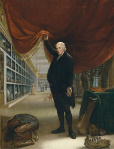 A painted self-portrait of Charles Willson Peale standing in his museum on the first floor of Independence Hall. Peale stands in the foreground lifting a red velvet curtain to reveal his museum in the background. Museum visitors view the exhibits and paintings on display.