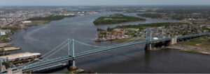 A color photograph of the Benjamin Franklin Bridge connecting Philadelphia to Camden over the Delaware River.
