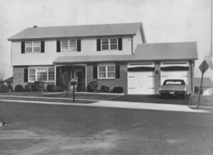 photograph of a split-level house with twin garages