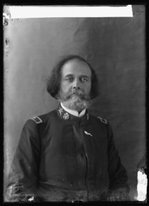 A black and white photograph of Theophilus Gould Steward in the uniform of the 25th United States Colored Infantry. A stiff white collar under the jacket of his uniform identifies him as a chaplain.