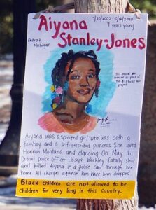 Photograph of a poster depicting Aiyana Stanley-Jones.