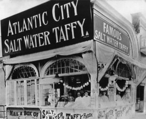 Photograph of candy booth selling salt water taffy.