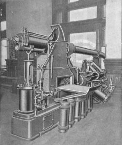 Photograph of a machine used to send tubes of mail through pipes.